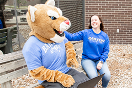 Bart hangs out with a student on campus